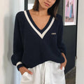 Mila Dark Blue V-neck knit sweater with double contrast trim, relaxed fit, and long sleeves