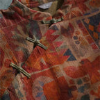 Mira Bronze corduroy midi dress close-up showing floral print and frog-button details