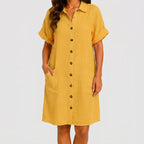 Front view of mustard yellow button front midi dress with short sleeves and side pockets by BELLA HUDSON