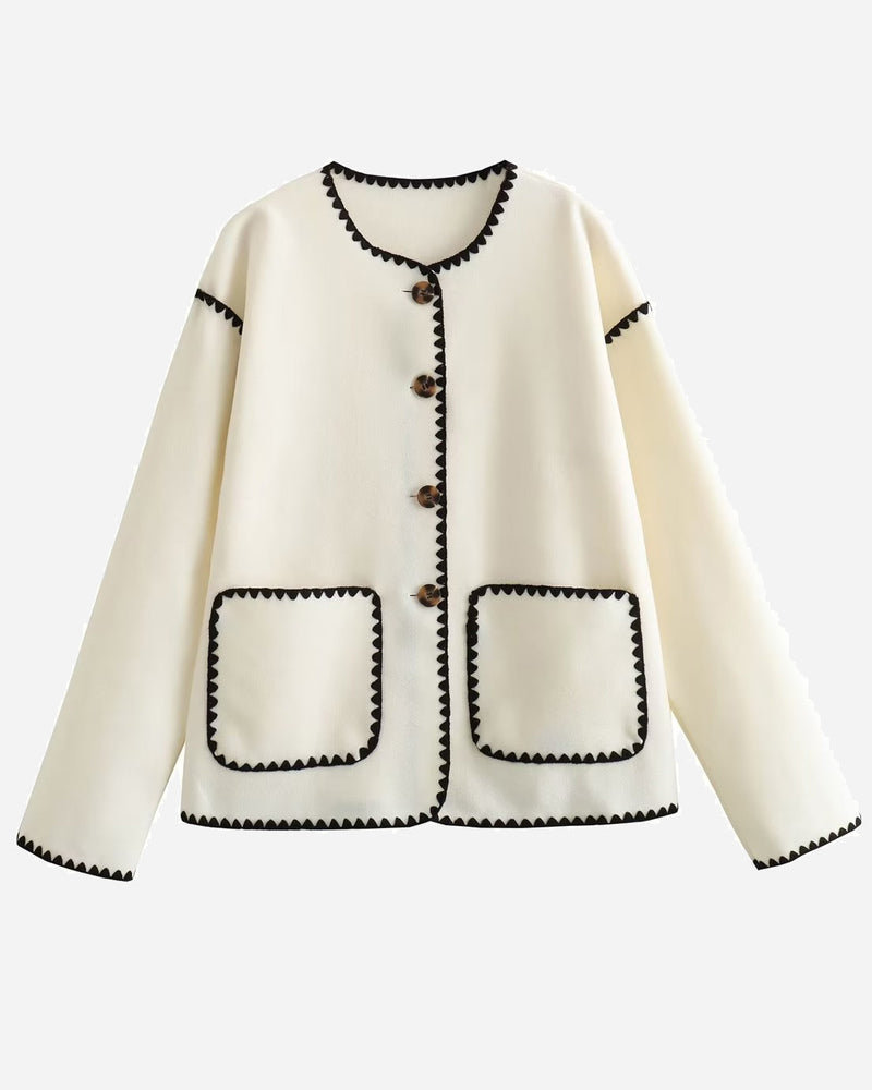 Nadorine White button-front jacket laid flat showing front buttons and patch pockets.