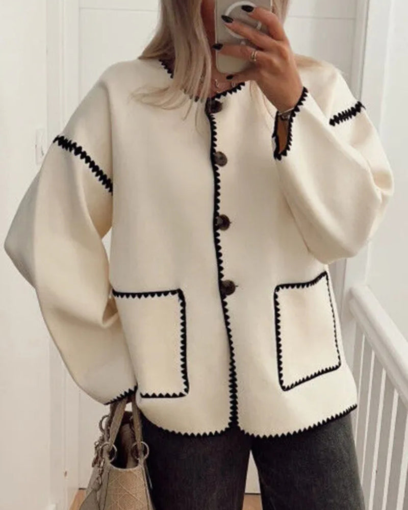 Nadorine White jacket worn with a relaxed fit and two stitched patch pockets.