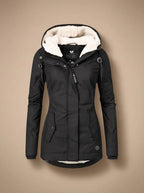 Naomi Black hooded long parka jacket featuring a plush-lined hood, fitted waist, full front closure, long sleeves, and front pockets