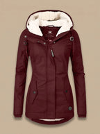 Naomi Red hooded parka jacket featuring a plush-lined hood, fitted silhouette, full front closure, and long sleeves