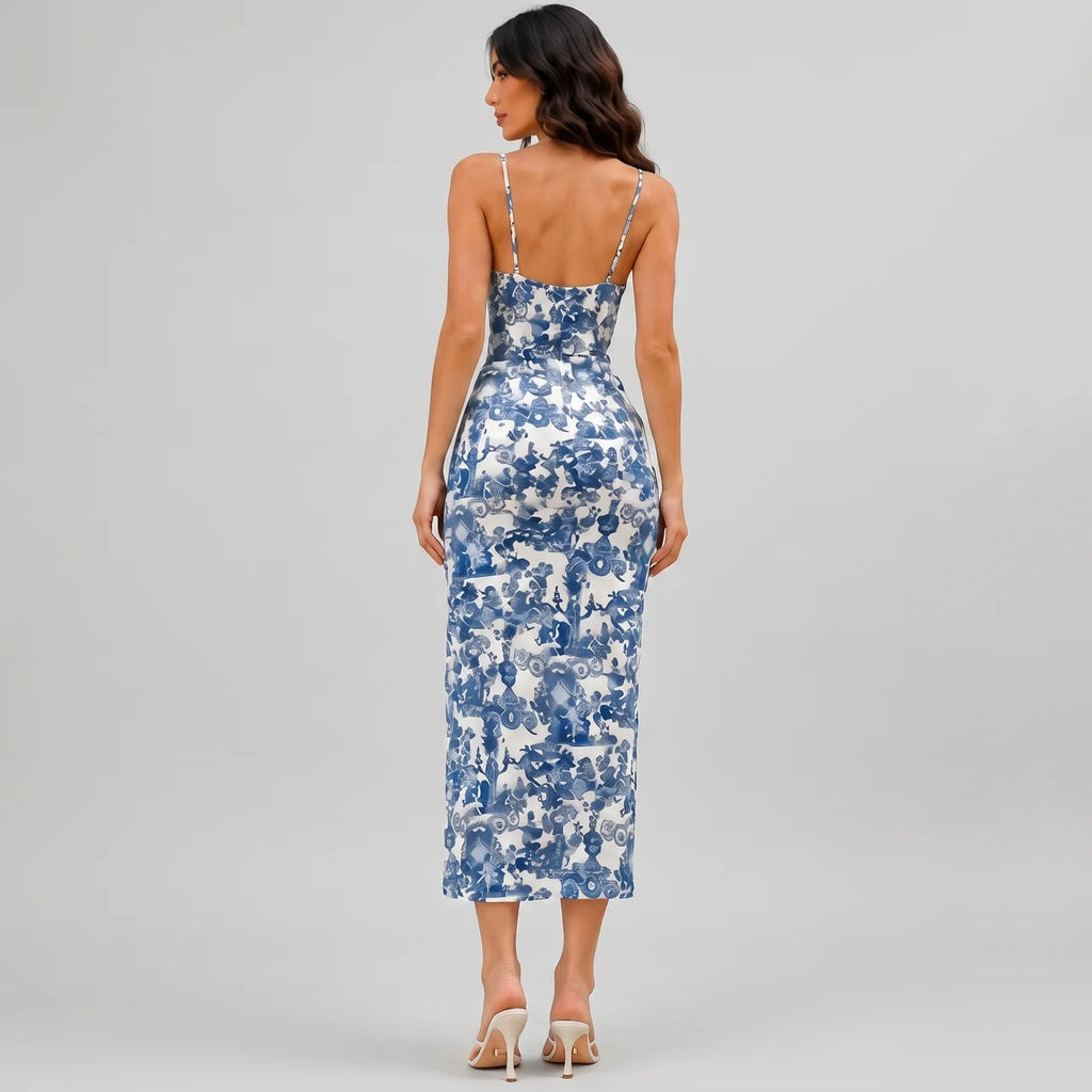 Back view of navy blue floral slit maxi dress with spaghetti straps and fitted silhouette by BELLA HUDSON