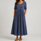 Navy blue speckled maxi dress front view with short sleeves and pockets BELLA HUDSON