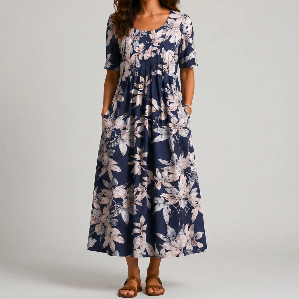 Navy floral maxi dress front view with short sleeves and pockets BELLA HUDSON