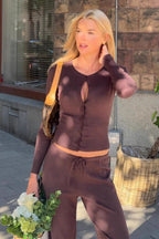 Nina Brown knit cardigan worn outdoors with matching brown drawstring pants.