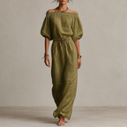 Noa Off-Shoulder Lightweight Linen Maxi Dress in green featuring an off-shoulder neckline, lantern sleeves, adjustable waist tie, and flowing maxi-length silhouette. Designed by Bella Hudson.