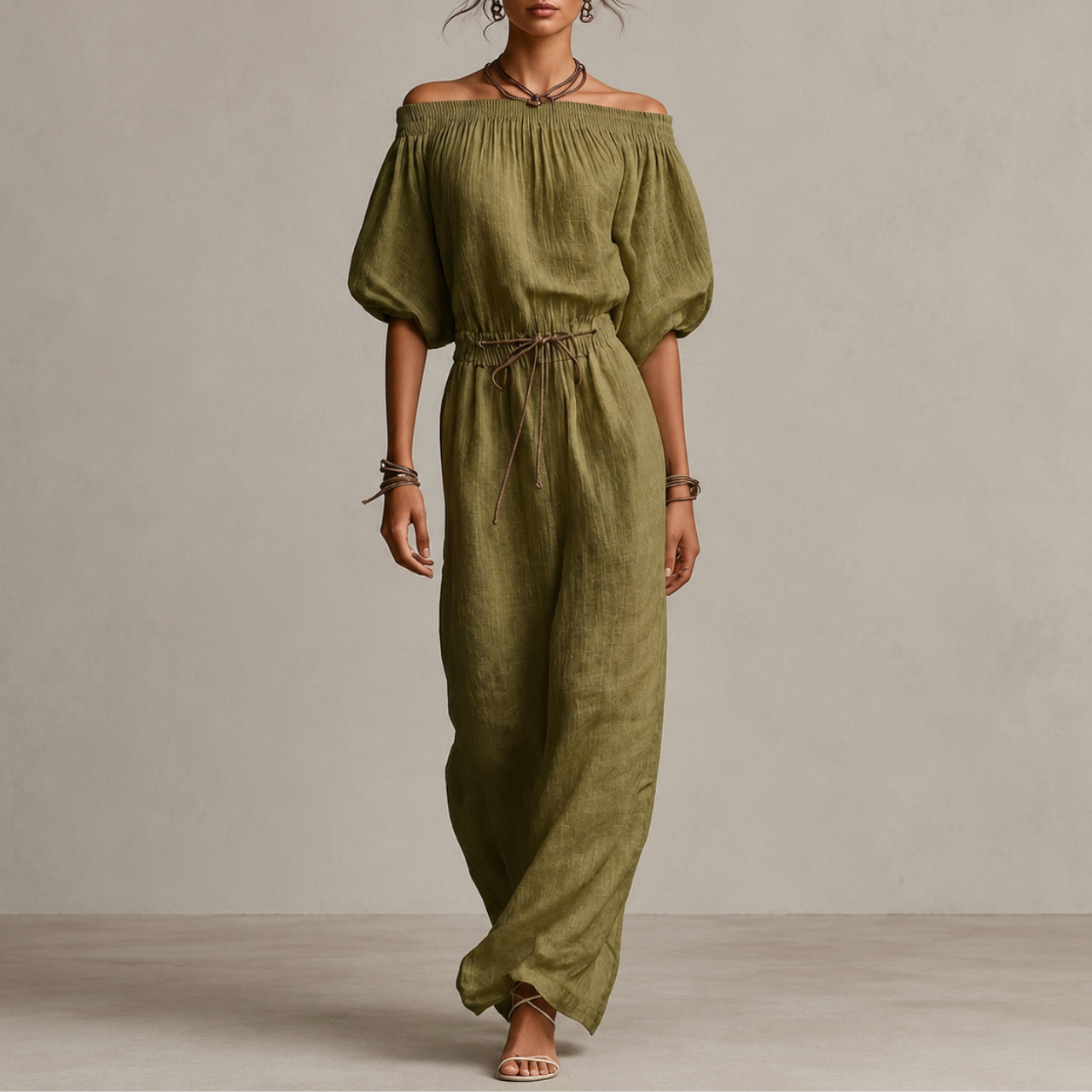 Noa Off-Shoulder Lightweight Linen Maxi Dress in green featuring an off-shoulder neckline, lantern sleeves, adjustable waist tie, and flowing maxi-length silhouette. Designed by Bella Hudson.