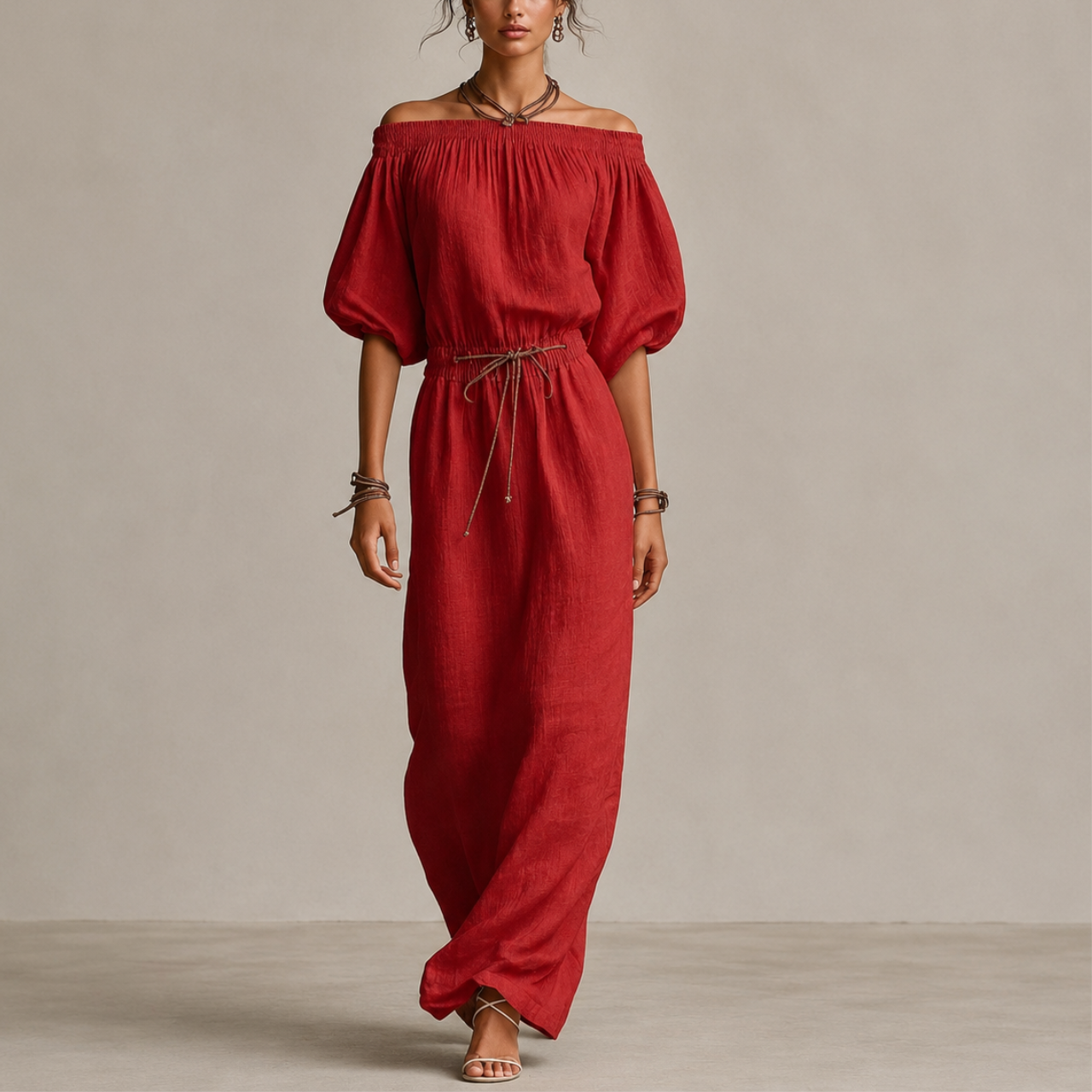 Noa Off-Shoulder Lightweight Linen Maxi Dress in red featuring an off-shoulder neckline, lantern sleeves, adjustable waist tie, and flowing maxi-length silhouette. Designed by Bella Hudson.