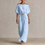 Noa Off-Shoulder Lightweight Linen Maxi Dress in sky blue featuring an off-shoulder neckline, lantern sleeves, adjustable waist tie, and flowing maxi-length silhouette. Designed by Bella Hudson.