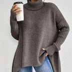 Noelle Brown oversized high-neck sweater featuring wide batwing sleeves, ribbed cuffs, side openings, and a relaxed fit