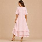 Noor Floral-Print Round-Neck Linen Midi Dress in Pink, back view showcasing the flowing layered design and relaxed fit. Designed by Bella Hudson.
