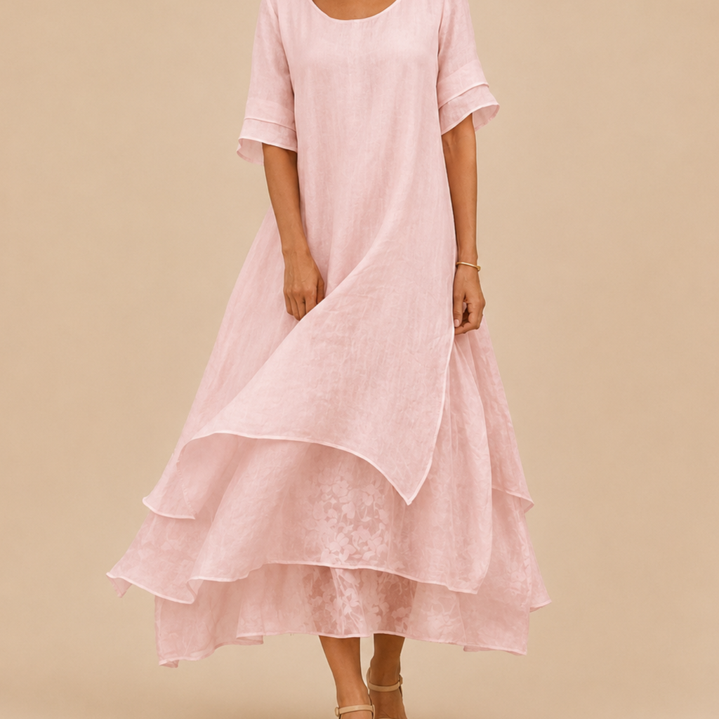 Close-up of the Noor Floral-Print Round-Neck Linen Midi Dress in Pink, highlighting the soft fabric, layered details, and elegant neckline. Designed by Bella Hudson.