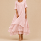 Noor Floral-Print Round-Neck Linen Midi Dress in Pink, front view featuring a relaxed fit and flowing layered silhouette. Designed by Bella Hudson.