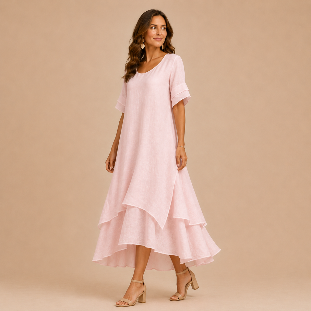 Noor Floral-Print Round-Neck Linen Midi Dress in Pink, full model view highlighting the elegant drape and lightweight layered design. Designed by Bella Hudson.