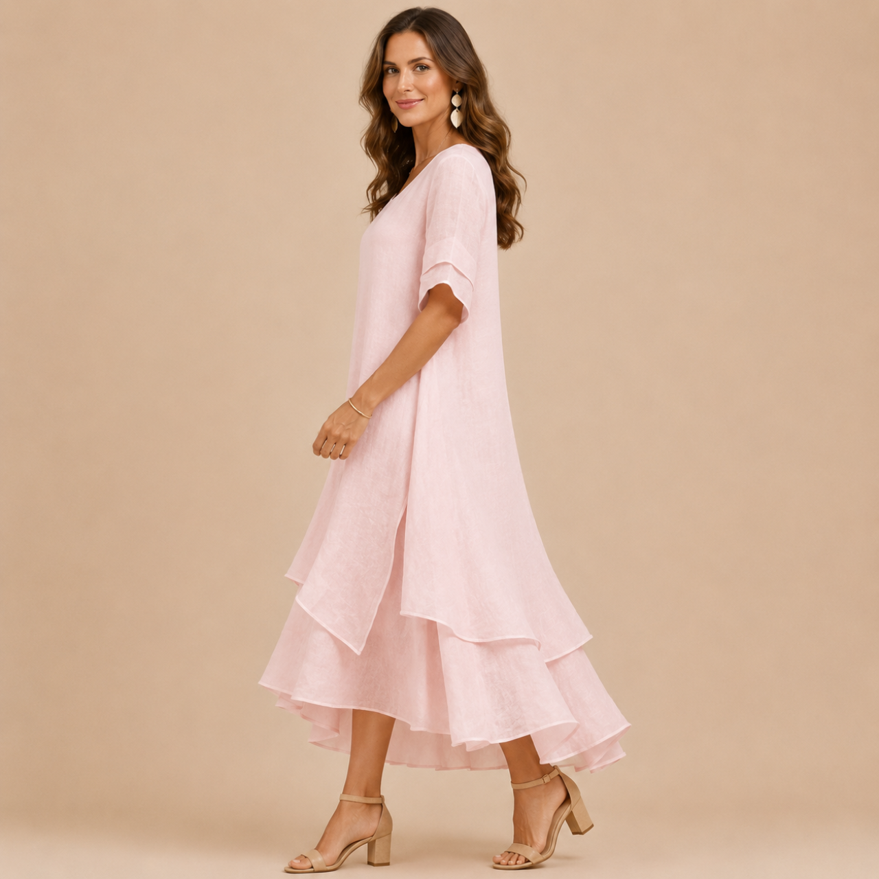 Noor Floral-Print Round-Neck Linen Midi Dress in Pink, side view showcasing the flowing layered hem and relaxed silhouette. Designed by Bella Hudson.