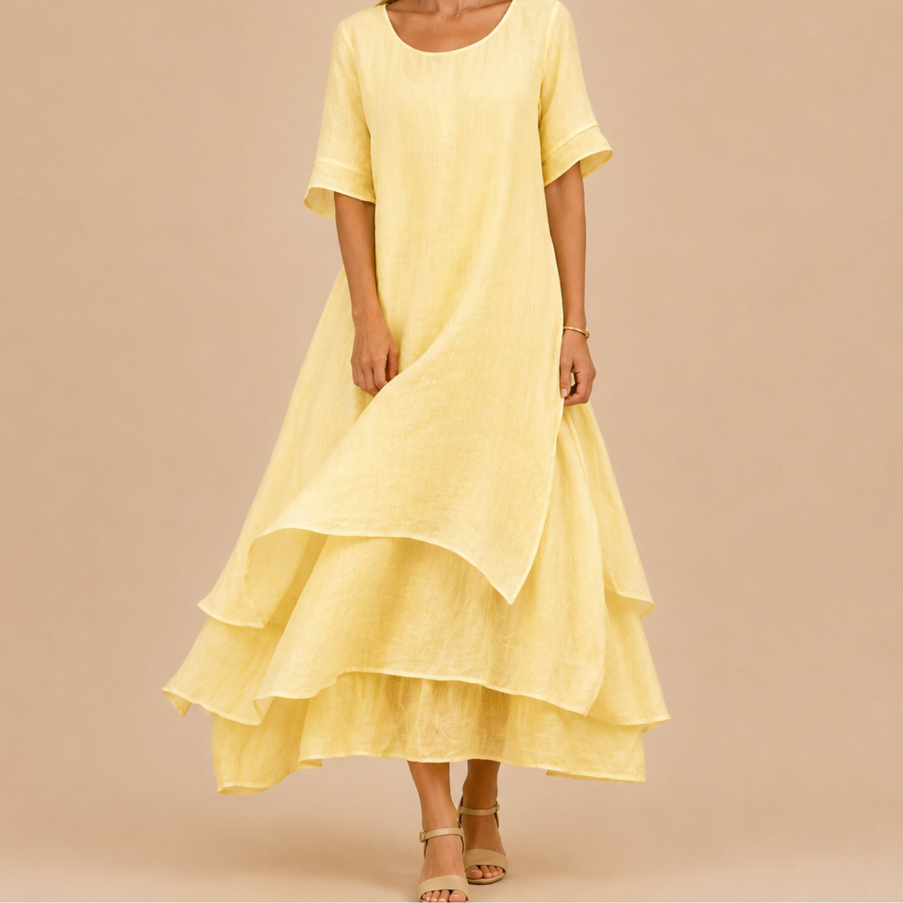 Noor Floral-Print Round-Neck Linen Midi Dress in Yellow, front view with layered flowing silhouette and elegant relaxed fit. Designed by Bella Hudson.