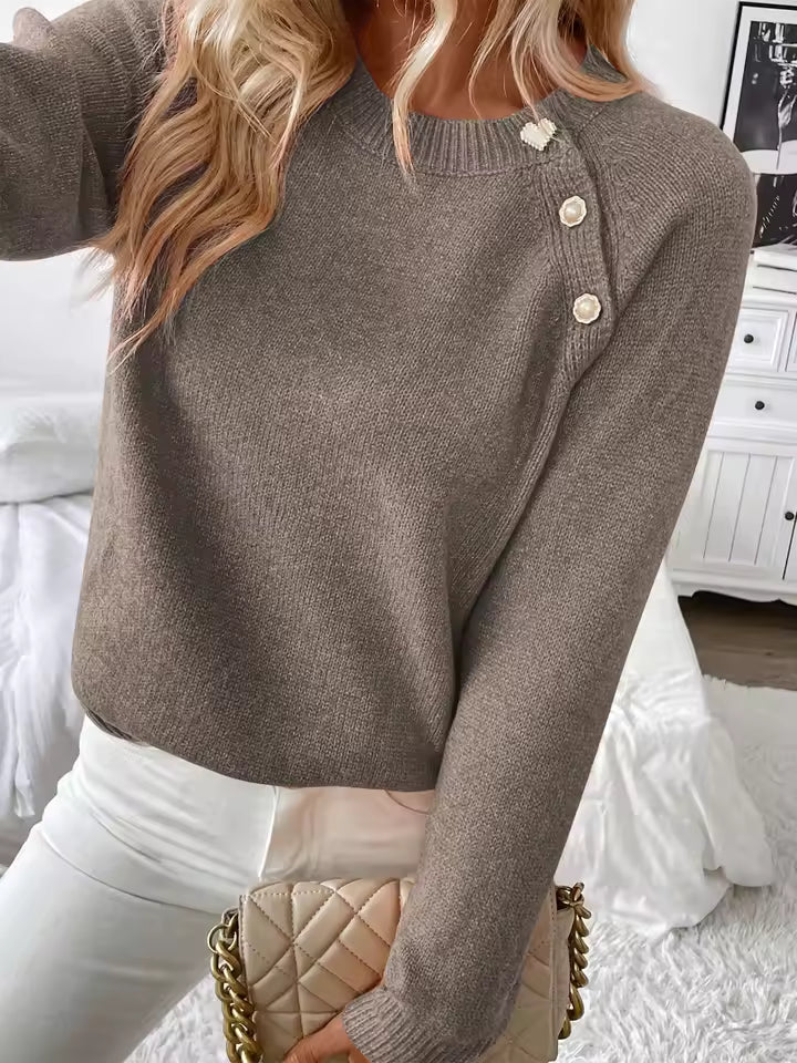 Nora Brown knit sweater with diagonal shoulder buttons, relaxed silhouette, and long sleevesNora Brown knit sweater with diagonal shoulder buttons, relaxed silhouette, and long sleeves