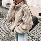 Nora Khaki chunky knit sweater featuring a folded turtleneck collar, relaxed silhouette, dropped shoulders, and balloon sleeves