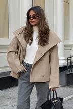 Nora Khaki cropped double-breasted jacket shown standing with a short relaxed silhouette, oversized lapels, and long sleeves