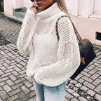 Nora White oversized open-knit sweater with a chunky turtleneck collar, voluminous sleeves, relaxed fit, and ribbed hem