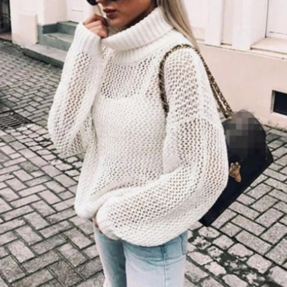 Nora White oversized open-knit sweater with a chunky turtleneck collar, voluminous sleeves, relaxed fit, and ribbed hem