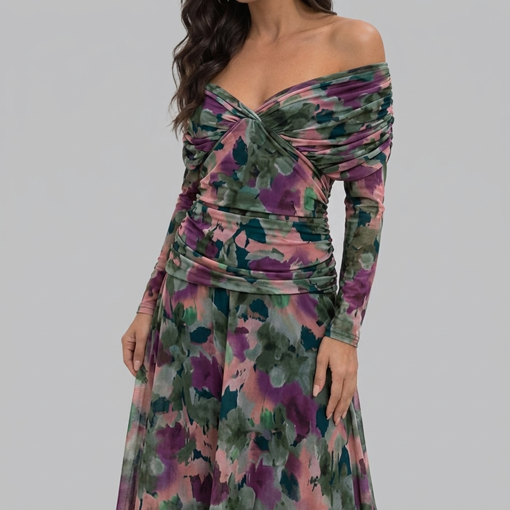 Close-up detail of the Nova Evening Maxi Dress with Off Shoulder and Ruched Waist Style in green floral, featuring the off-the-shoulder neckline, ruched bodice, and vibrant floral print. Designed by Bella Hudson.