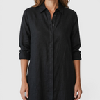 Close-up detail of the Océane Shirt Dress Linen-Cotton Knot-Waist Maxi in black, featuring the collared neckline, button-front placket, and linen-cotton texture. Designed by Bella Hudson.