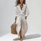 Front view of the Océane Shirt Dress Linen-Cotton Knot-Waist Maxi in white, featuring a collared neckline, button-front closure, knot-waist detail, and a flowing maxi-length silhouette. Designed by Bella Hudson.
