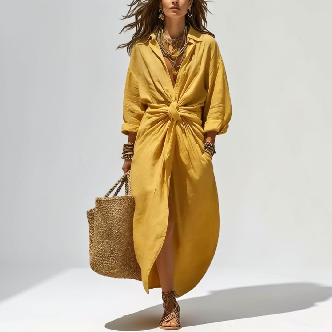 Front view of the Océane Shirt Dress Linen-Cotton Knot-Waist Maxi in yellow, featuring a collared neckline, button-front closure, knot-waist detail, front slit, and an elegant flowing silhouette. Designed by Bella Hudson.