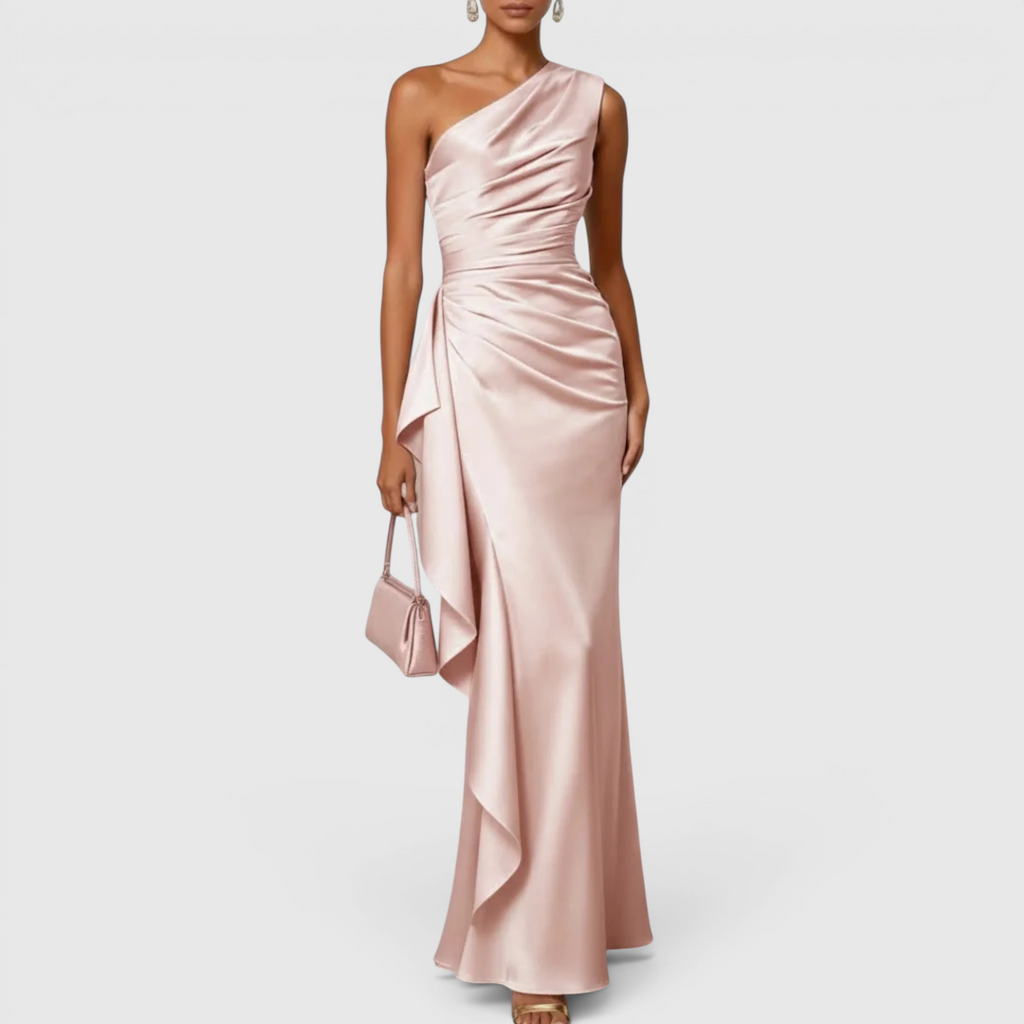 Front view of the Odessa Maxi Evening Dress Satin One-Shoulder Ruffle Style in light pink, featuring a one-shoulder neckline, ruched satin bodice, draped waist detail, and a graceful flowing maxi silhouette. Designed by Bella Hudson.