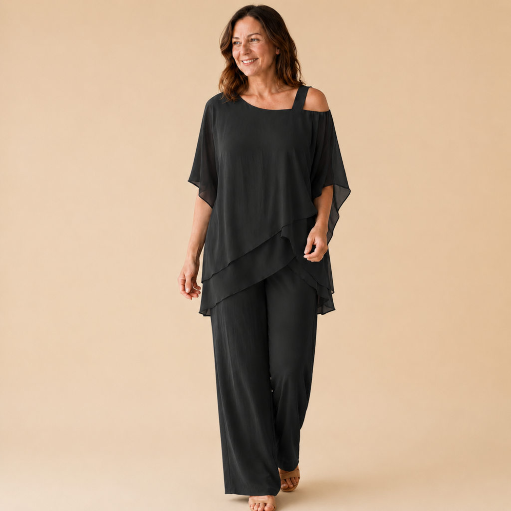 Bella Hudson Odette Two-Piece Set in Black featuring a layered cold-shoulder top and wide-leg pants, front view.