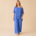 Bella Hudson Odette Two-Piece Set in Blue featuring a layered cold-shoulder top and wide-leg pants, front view.