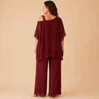 Bella Hudson Odette Two-Piece Set in Burgundy featuring a layered cold-shoulder top and wide-leg pants, back view.