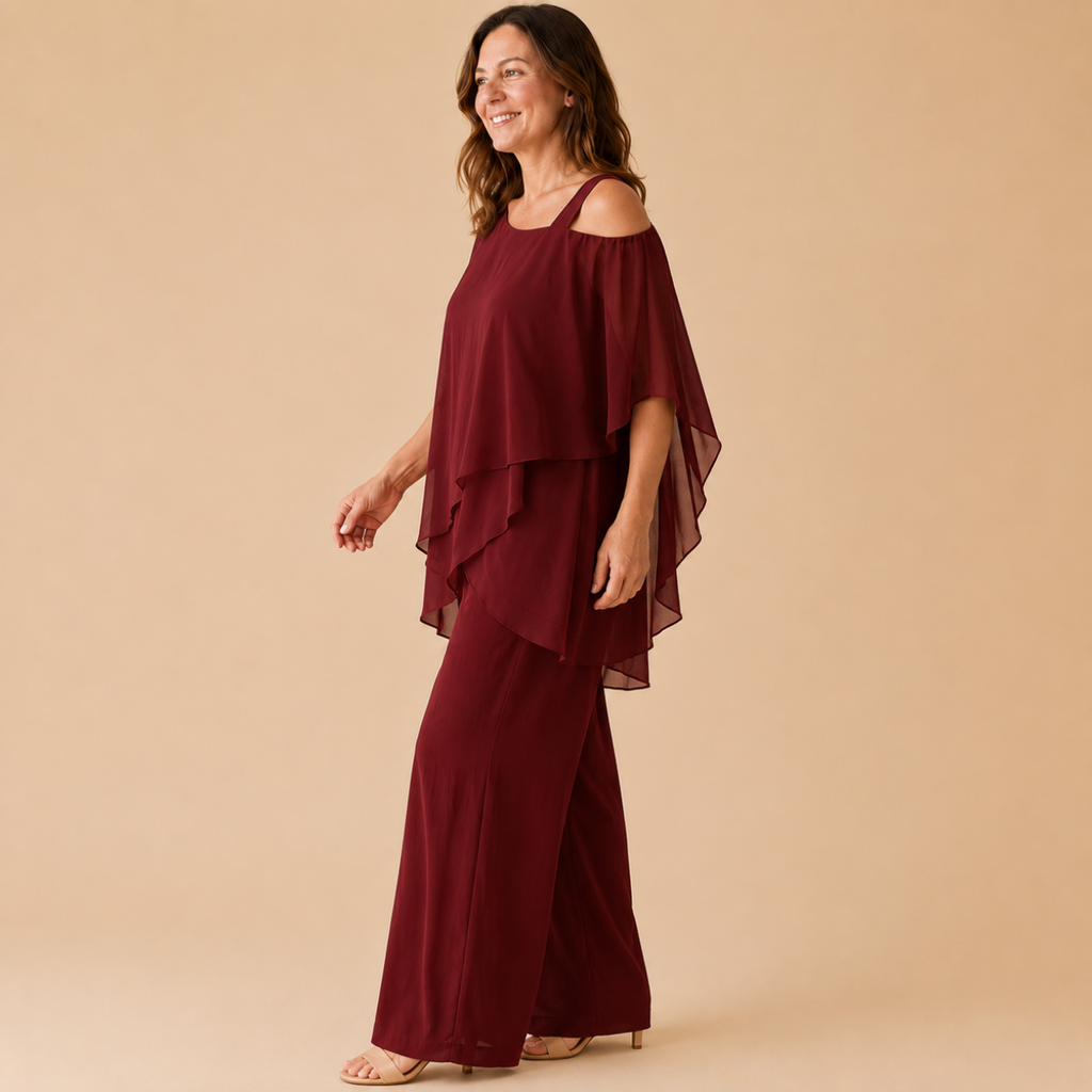 Bella Hudson Odette Two-Piece Set in Burgundy featuring a layered cold-shoulder top and wide-leg pants, side view.