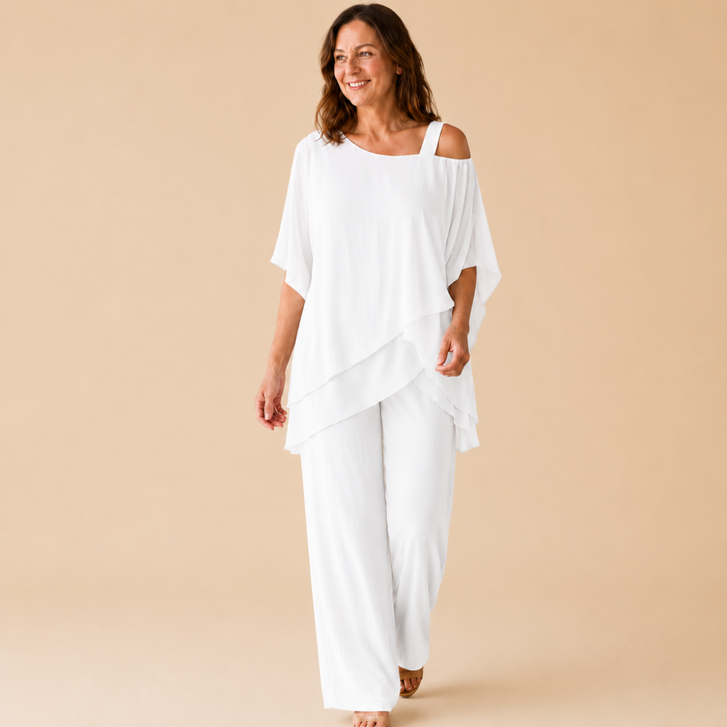 Bella Hudson Odette Two-Piece Set in White featuring a layered cold-shoulder top and wide-leg pants, front view.