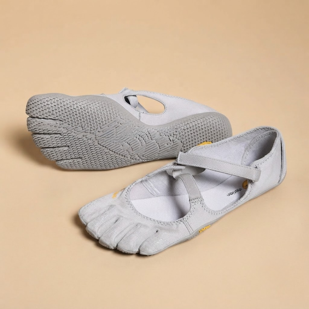 Odette Woman's Barefoot Flats Five-Toe Lightweight in Grey shown in front view, featuring an ergonomic five-toe design, breathable upper, flexible barefoot sole, lightweight construction, and wide toe box, designed by Bella Hudson.