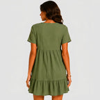Back view of olive green tiered mini dress with short sleeves by BELLA HUDSON