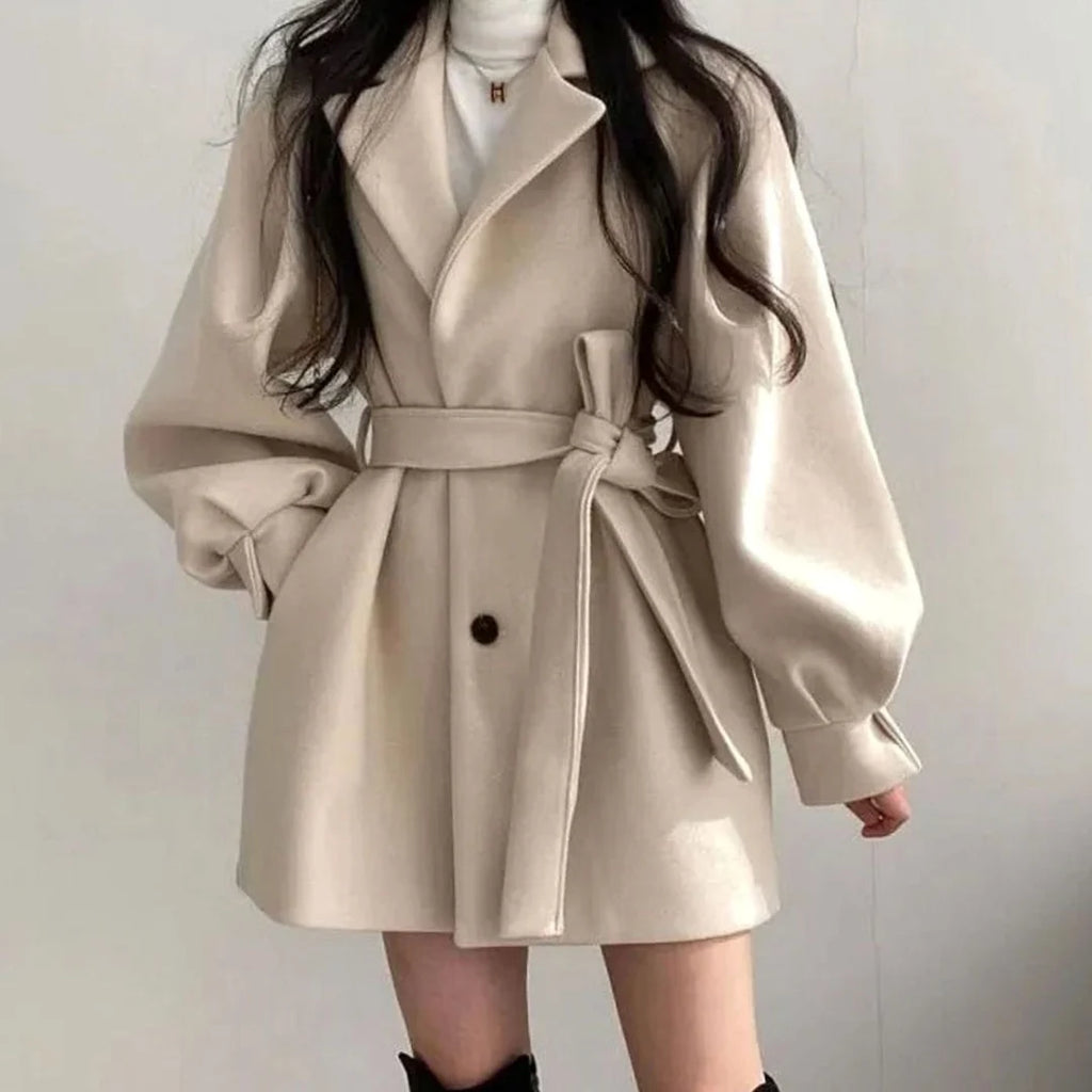 Olivia Beige short wool-look coat with wide lapel collar, adjustable waist belt, voluminous sleeves, and flared A-line silhouette