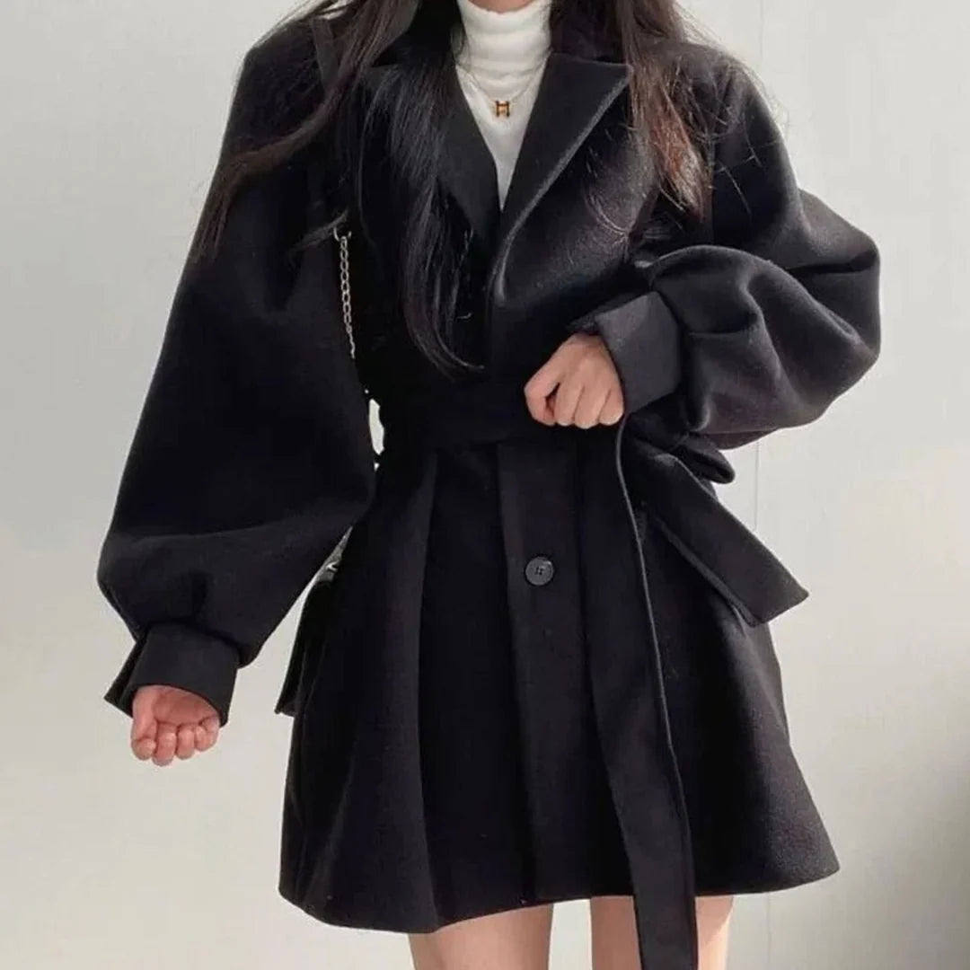 Olivia Black belted short coat featuring wide lapels, voluminous long sleeves, button-front closure, and a flared hem