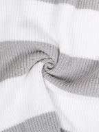 Olivia White striped knit sweater close-up showing textured knit fabric, contrasting stripes, and ribbed detailing