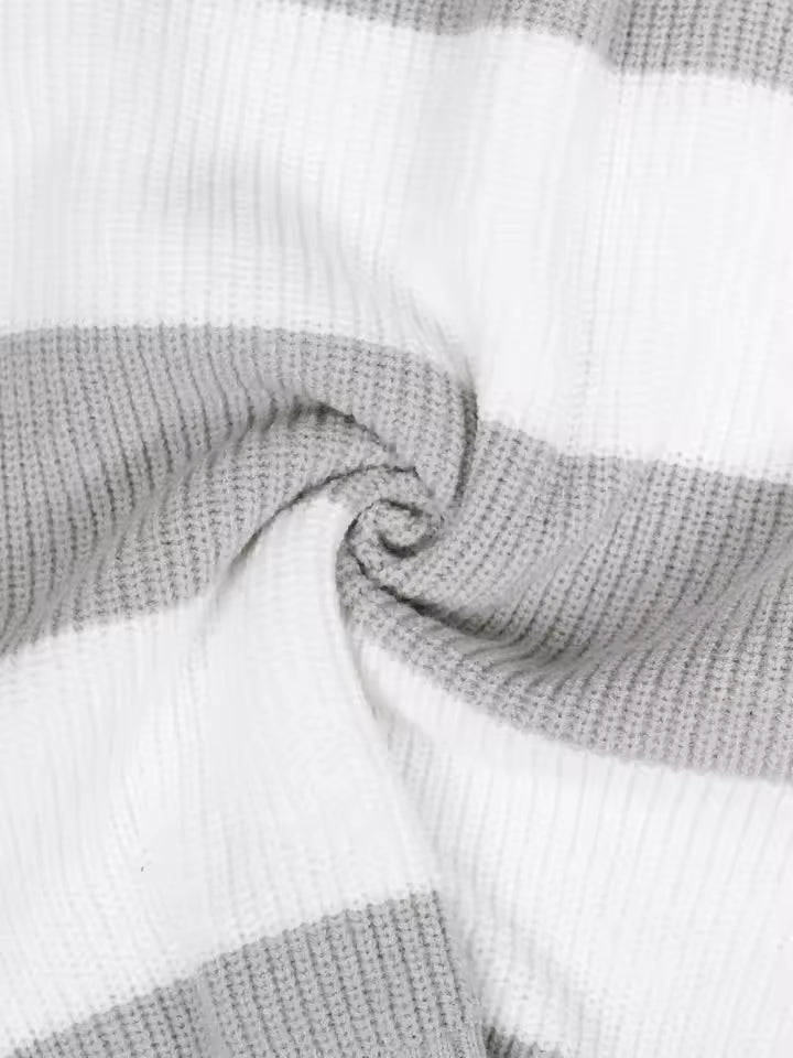 Olivia White striped knit sweater close-up showing textured knit fabric, contrasting stripes, and ribbed detailing