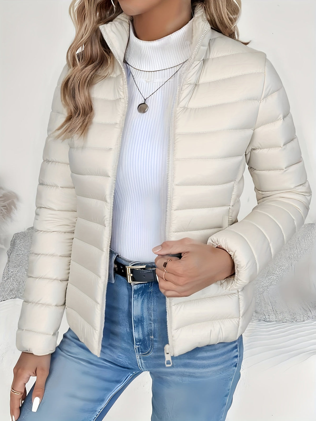 Front view of the Ondine Jacket Puffer Stand-Collar in white, featuring a stand collar, quilted puffer construction, zip-front closure, and a lightweight insulated silhouette. Designed by Bella Hudson.