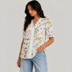 Side view of orange floral button blouse with short sleeves and relaxed fit by BELLA HUDSON