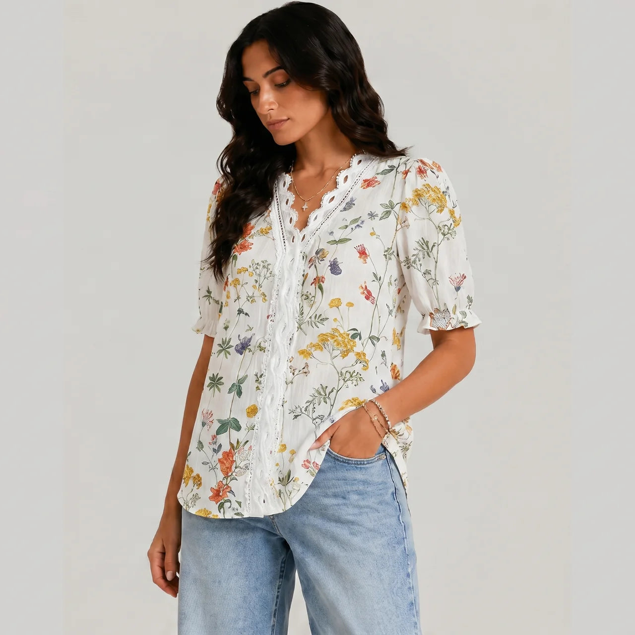 Side view of orange floral button blouse with short sleeves and relaxed fit by BELLA HUDSON