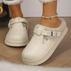 Paige Beige slip-on mule slippers featuring plush faux-fur lining, decorative buckle straps, open backs, and thick soles