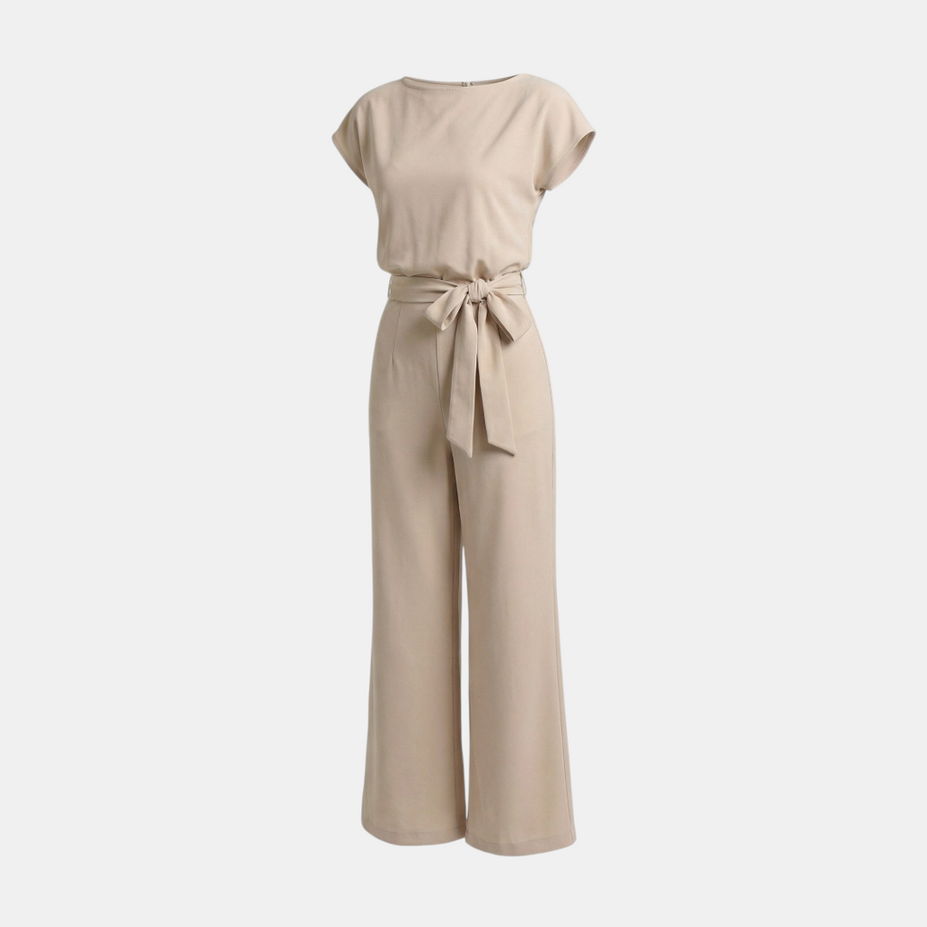 Front view of the Paloma Jumpsuit Wide-Leg Tie-Waist in beige, featuring a round neckline, cap sleeves, self-tie waist belt, and a relaxed wide-leg silhouette. Designed by Bella Hudson.