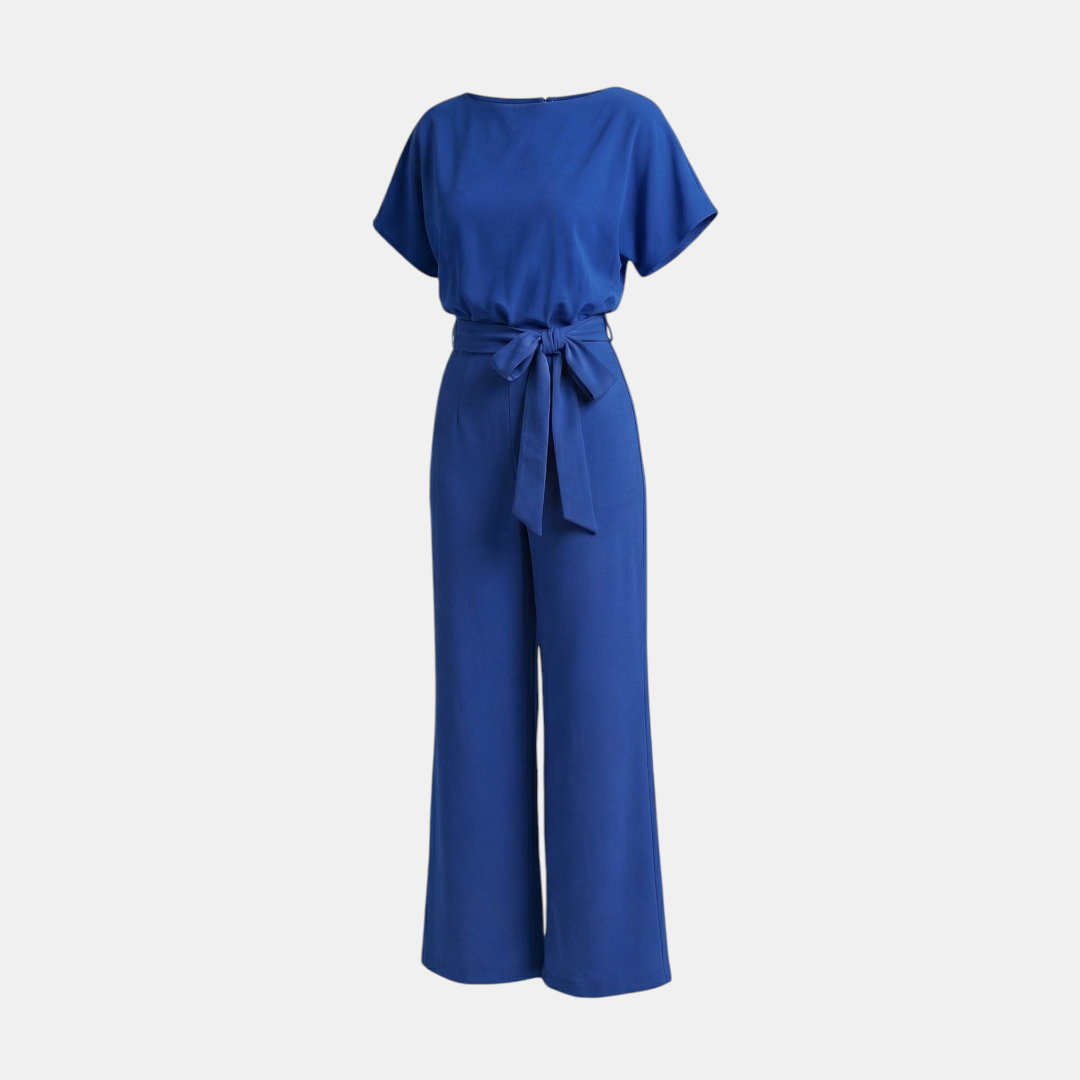 Front view of the Paloma Jumpsuit Wide-Leg Tie-Waist in blue, featuring a round neckline, cap sleeves, self-tie waist, and a relaxed wide-leg fit. Designed by Bella Hudson.