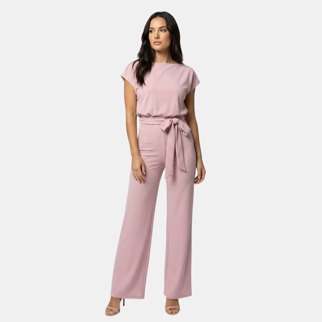 Front view of the Paloma Jumpsuit Wide-Leg Tie-Waist in pink, featuring a round neckline, cap sleeves, elastic tie waist, wide-leg silhouette, and a relaxed elegant fit. Designed by Bella Hudson.